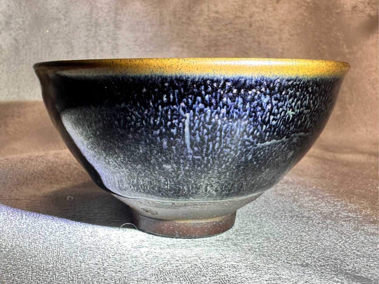 Golden rim black glaze blue rain drops kiln transformed pattern tied mouth shape black ceramic Jianzhan cup