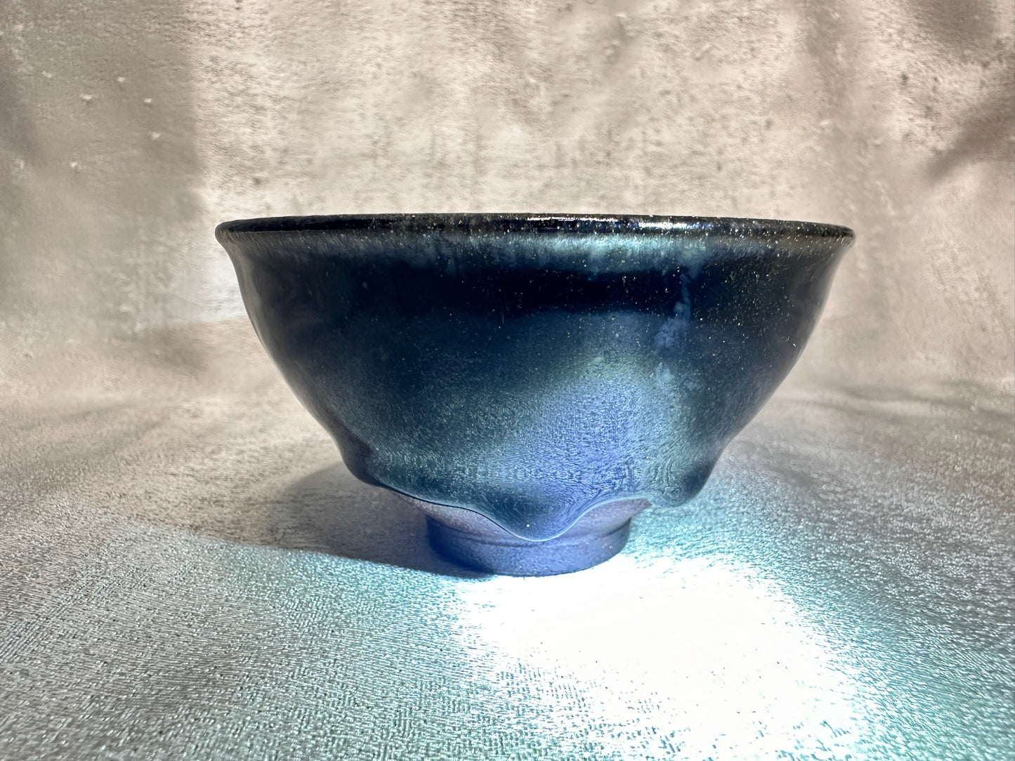 Black glaze kiln transformed golden sands blue hare’s fur pattern tied mouth shape cup with glaze tears, drippy