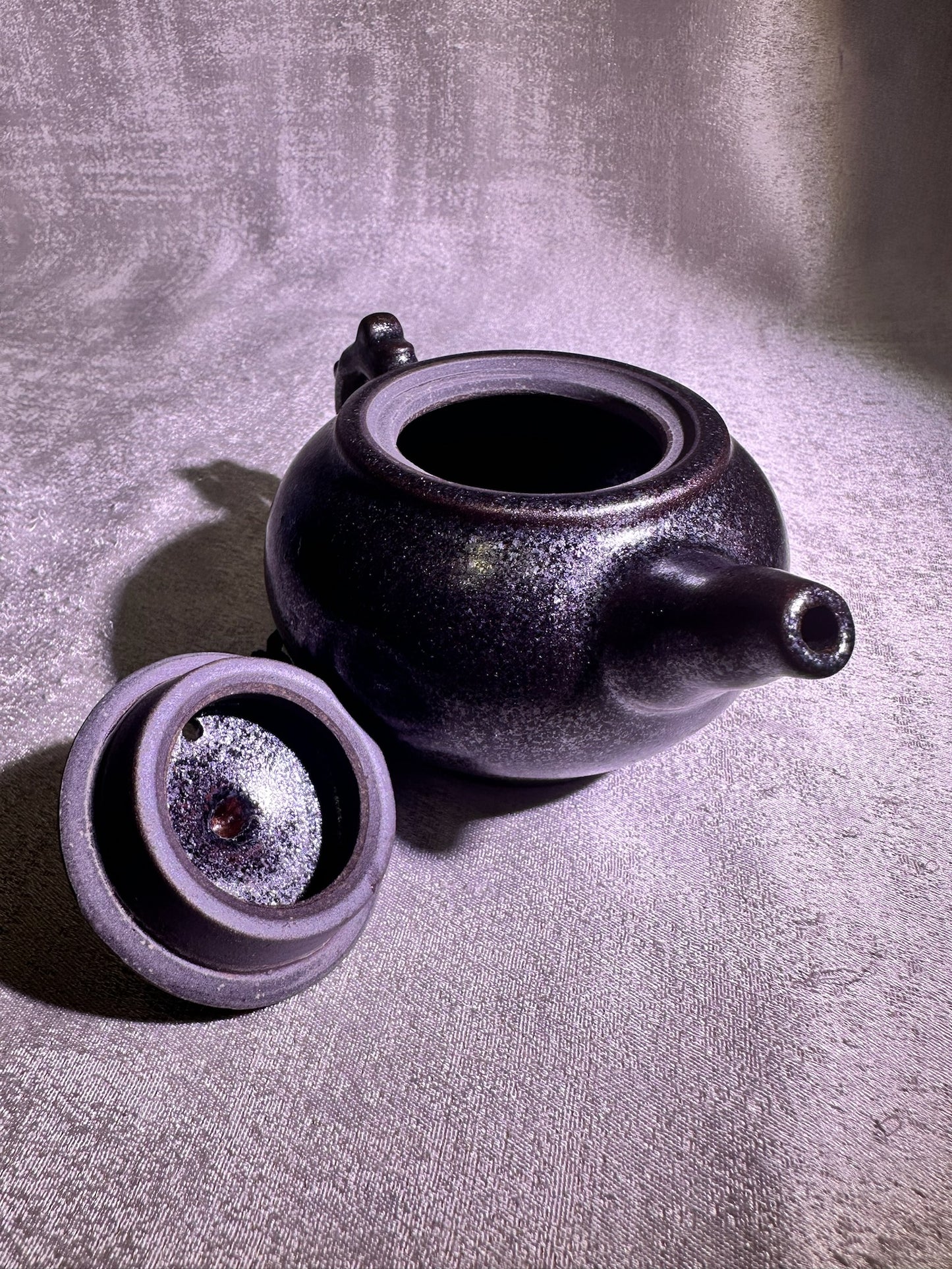 Black gold, ox-blood red glaze, silver snow flake pattern teapot