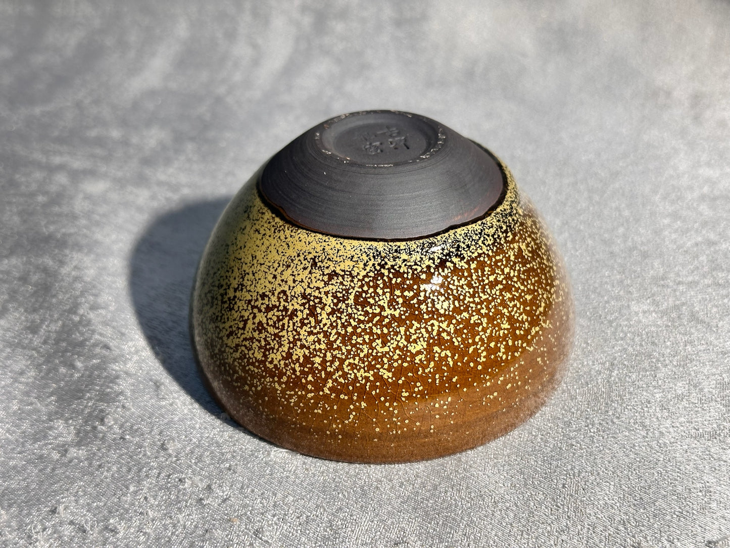 Cup1-Brown jade-like glaze daisy oil droplets pattern ice crackles monk bowl shape cup 古潭花 by WangZhangLiang