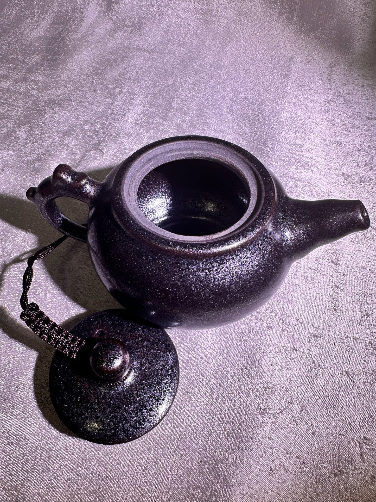 Black gold, ox-blood red glaze, silver snow flake pattern teapot