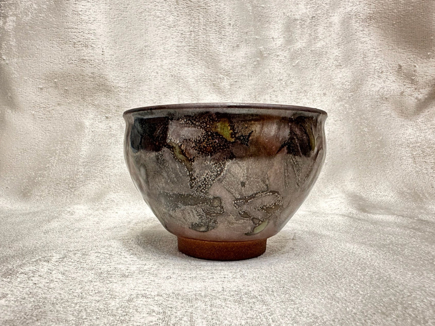 Brown glaze kiln transformed jade-like green and white mountain river scenery tied mouth shape cup