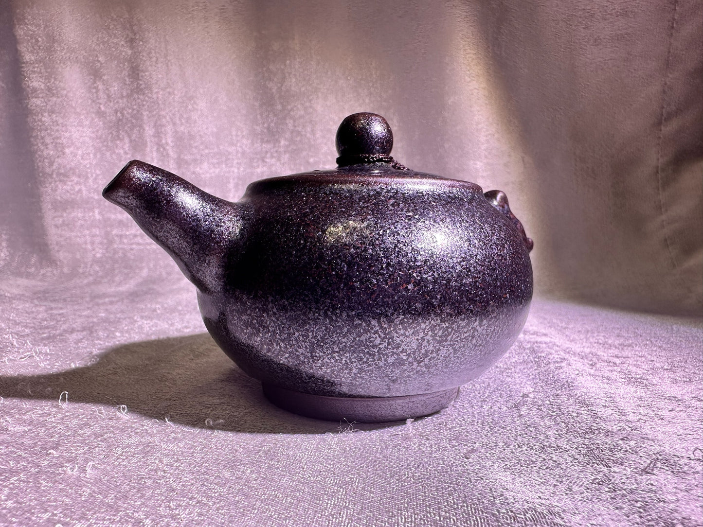 Black gold, ox-blood red glaze, silver snow flake pattern teapot