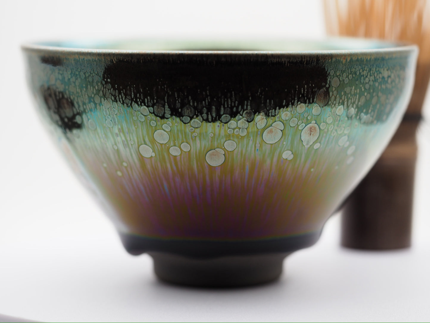 Multi color galaxy-like yohen glaze tied mouth Diancha tea bowl with one glaze tear drop