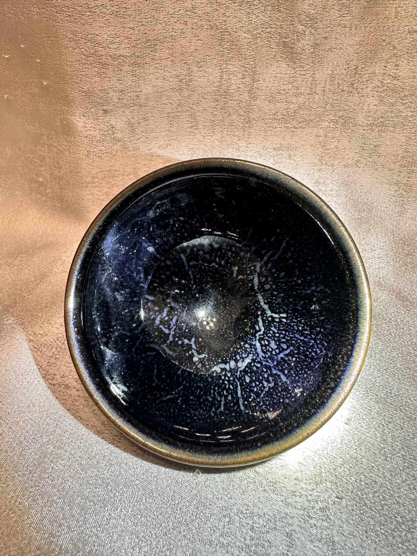 Golden rim black glaze blue rain drops kiln transformed pattern tied mouth shape black ceramic Jianzhan cup