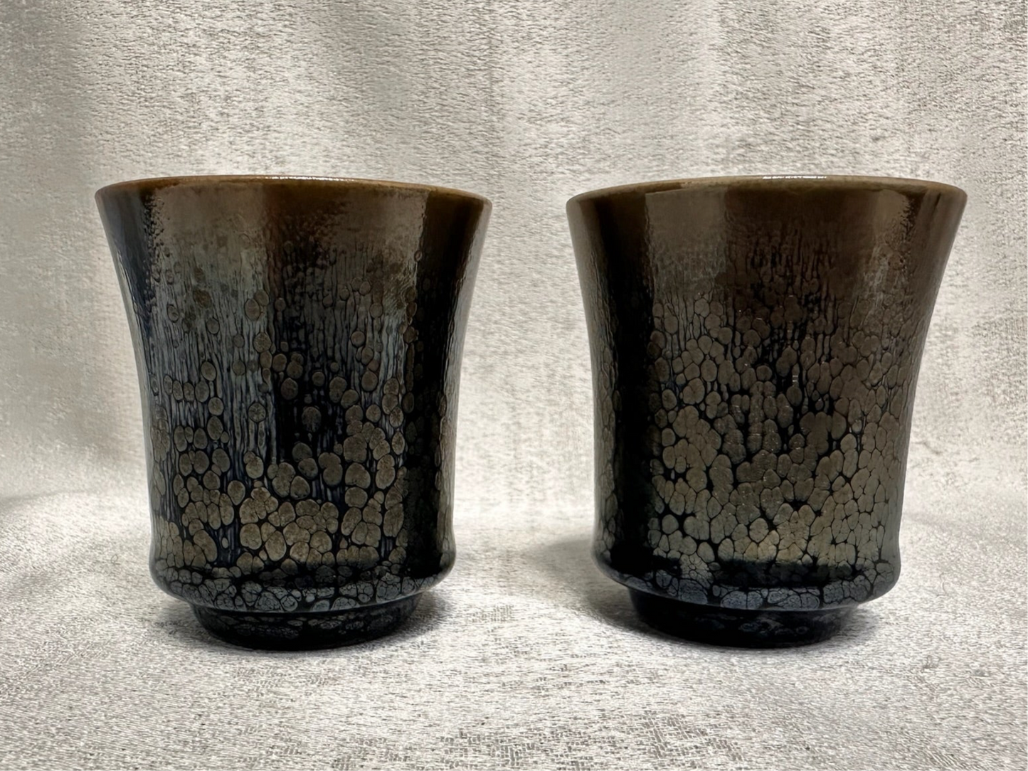 Double sided glaze, interior jade-like glaze exterior black glaze silver oil droplet sake wine cup set