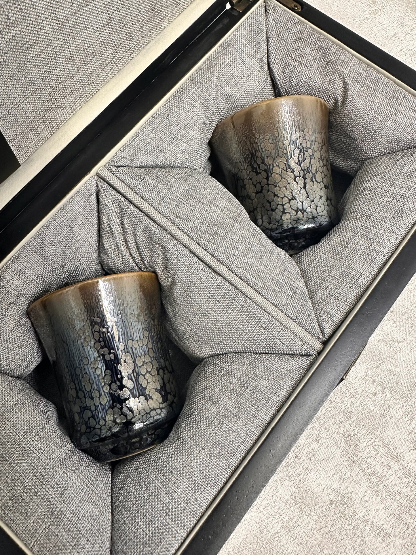 Double sided glaze, interior jade-like glaze exterior black glaze silver oil droplet sake wine cup set